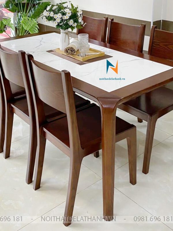 Bàn Ăn Mặt Đá 6 Ghế Tại Hà Nội chất liệu gỗ sồi Nga, có thiết kế hiện đại: mặt đá lọt bên trong khung bàn cho cảm giác chắc chắn, đi kèm là 6 ghế một tựa rất đẹp mắt