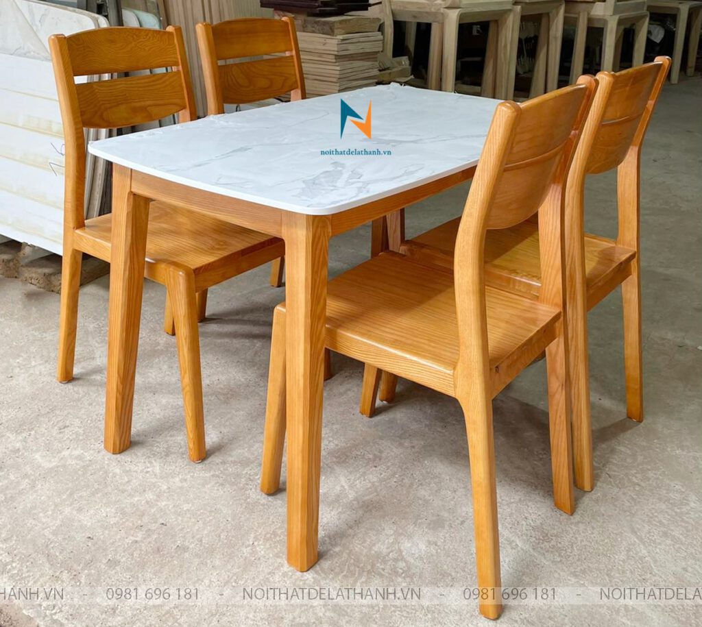 Bộ Bàn Ăn 4 Ghế Mặt Đá: Chân bàn thuộc loại chân vuông; ghế phong cách 2 lá ngang hiện đại