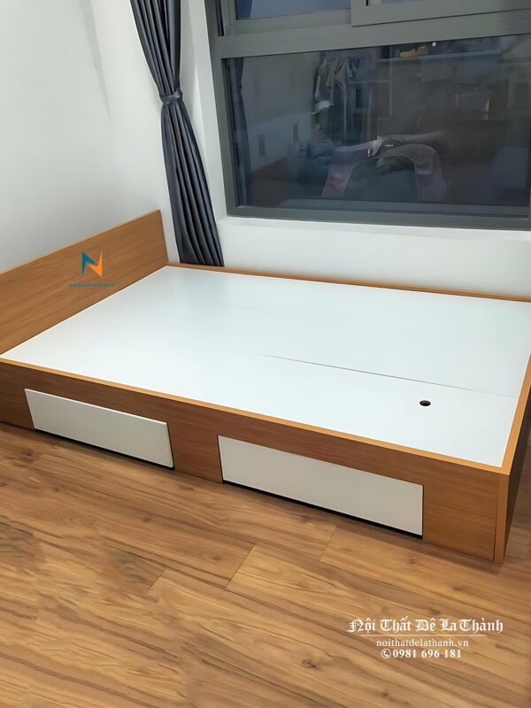 Chiếc giường đơn 1m2 phân khúc giá rẻ, chất liệu gỗ công nghiệp mdf, vai trái có 2 ngăn kéo, đầu cao cao 60cm
